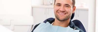 Patient smiling in treatment chair at emergency dentist in Foothill Ranch, CA