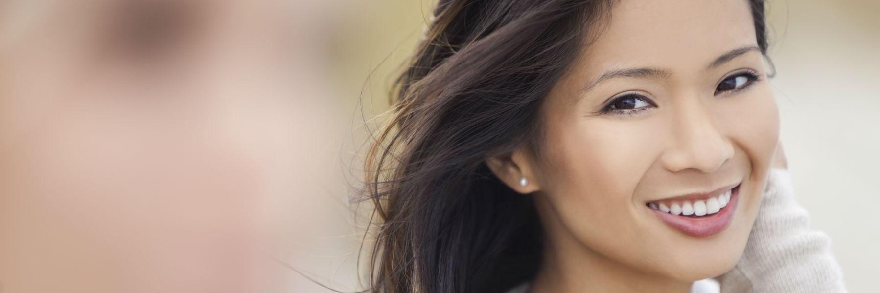 Woman with veneers smiling in Lake Forest, CA