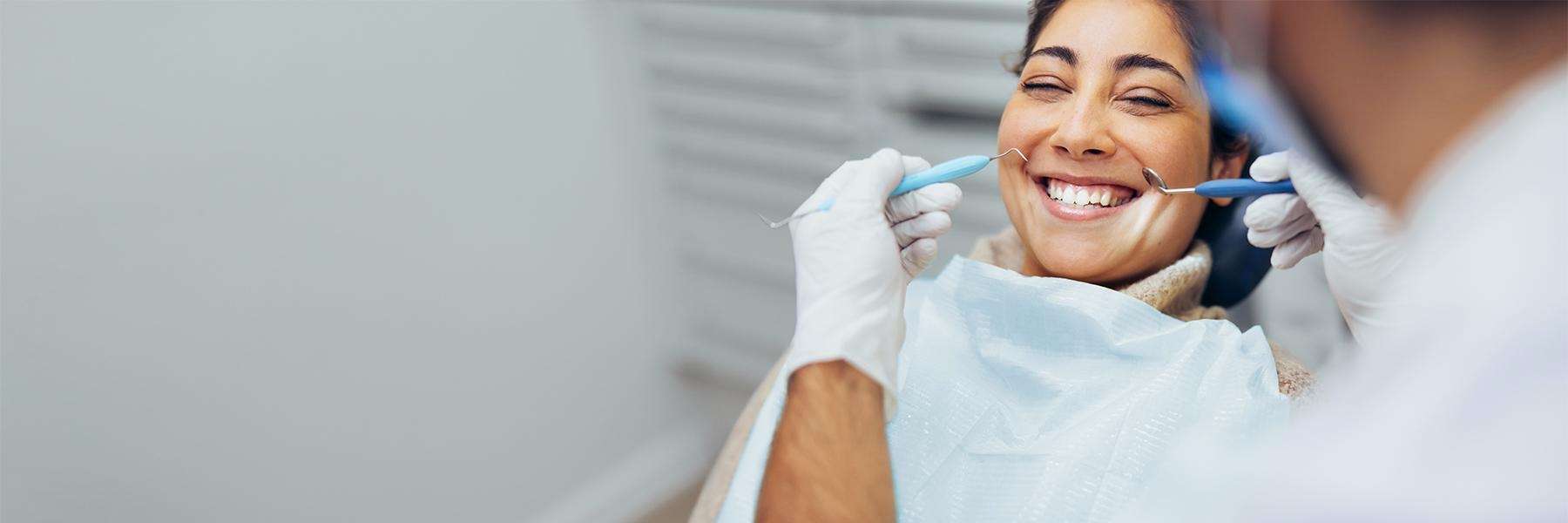 Patient in chair at dentist for tooth colored fillings in Foothill Ranch, CA