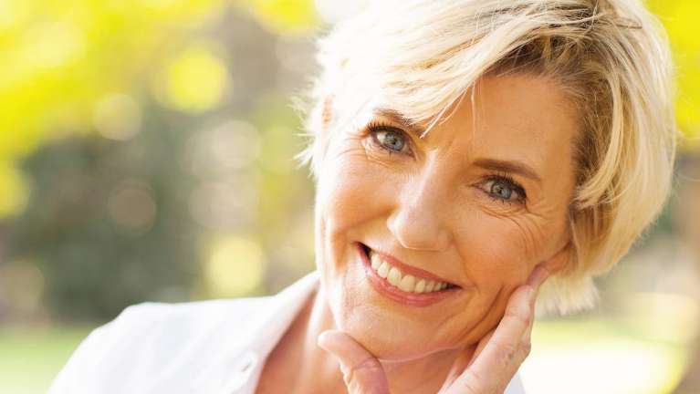Older blonde woman smiling, foothill ranch ca