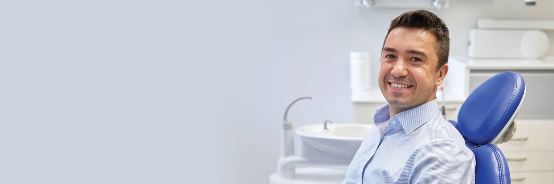 Man smiling in treatment chair at dentist in Lake Forest CA