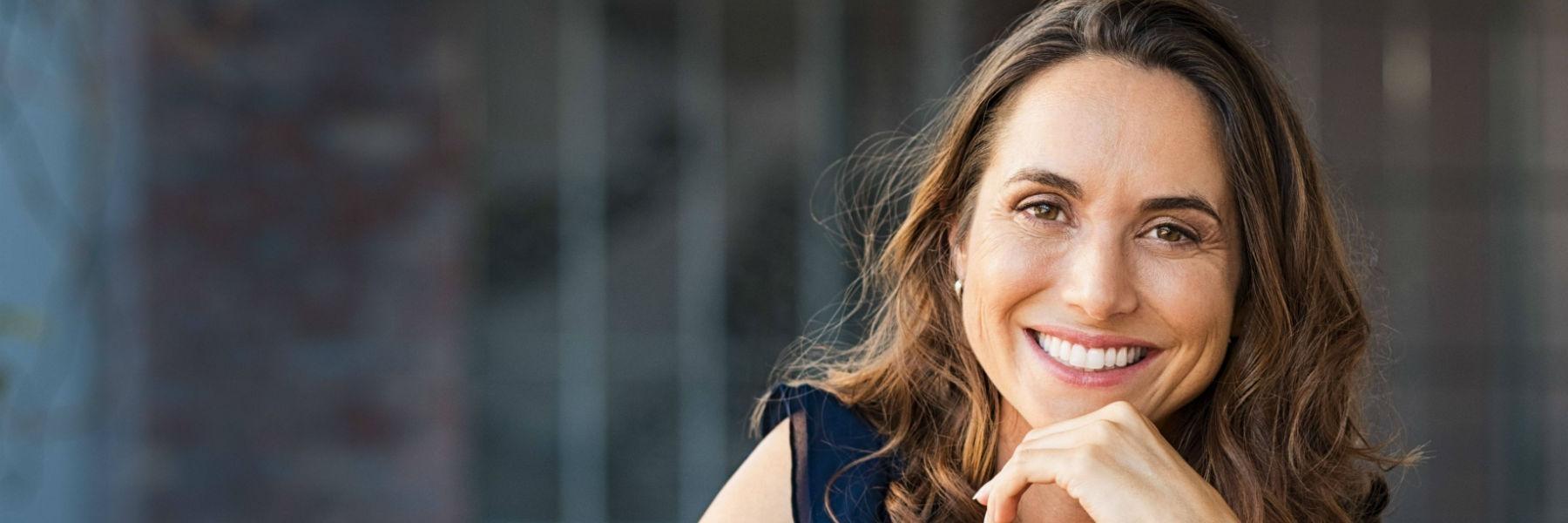 Woman wearing Invisalign aligners in Lake Forest CA